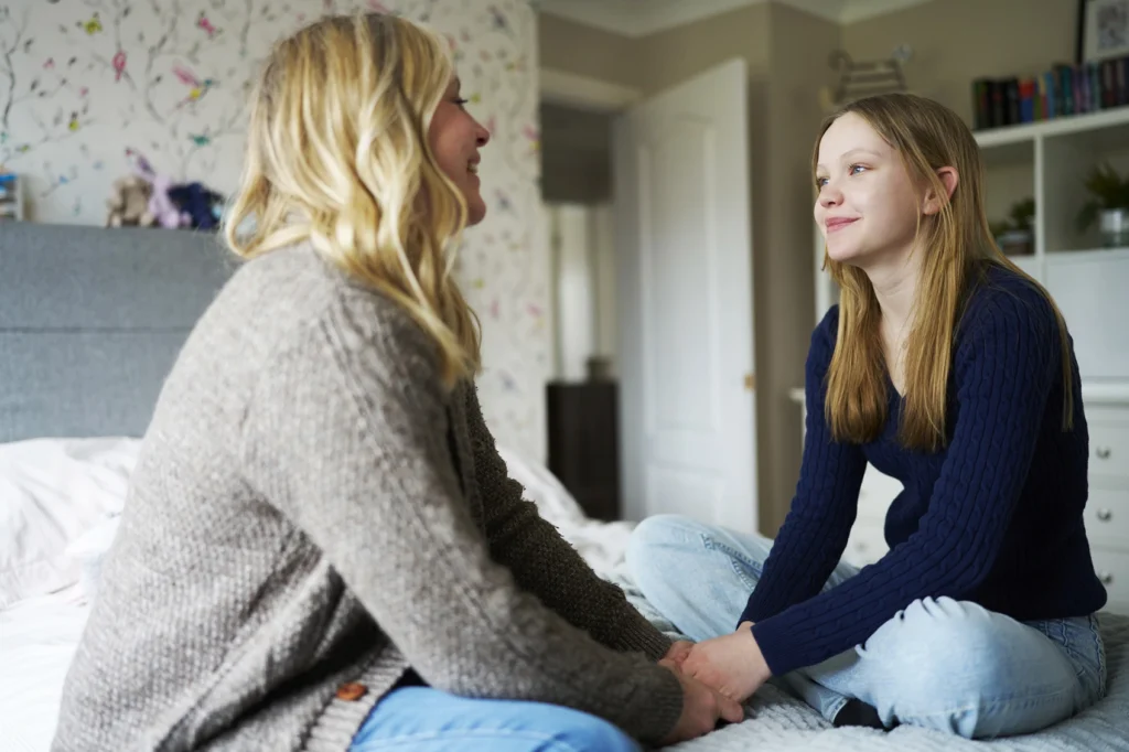 Parent talking with teen child